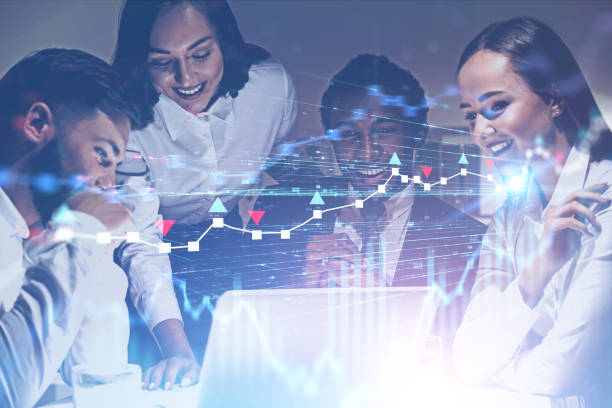 istock Happy business team in office, forex graphs 1163784261