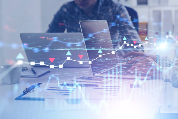 istock Blurred business people in office, forex charts 1163784517
