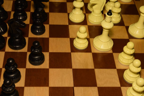 istock Wooden chess board under black pieces for hobby theme 1163786856