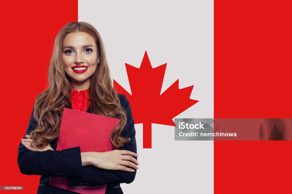 Canada concept. Young woman student with the Canada flag. Live, work, education and internship in Canada Canada Stock Photo