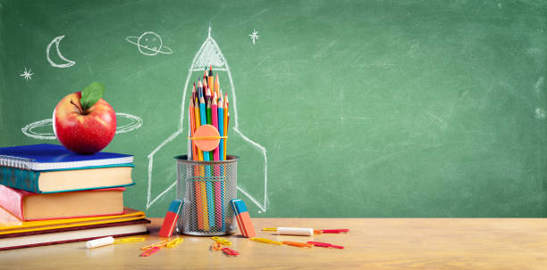 istock Back To School - Books And Pencils With Rocket Sketch 1163788724