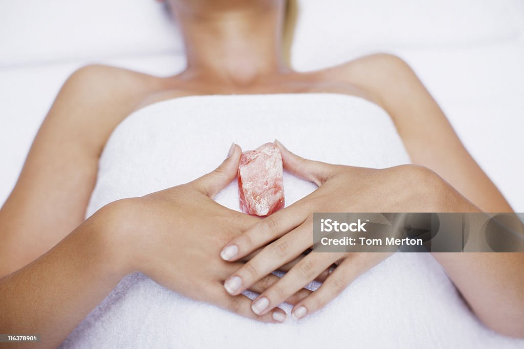 Woman laying with crystal  Crystal Stock Photo