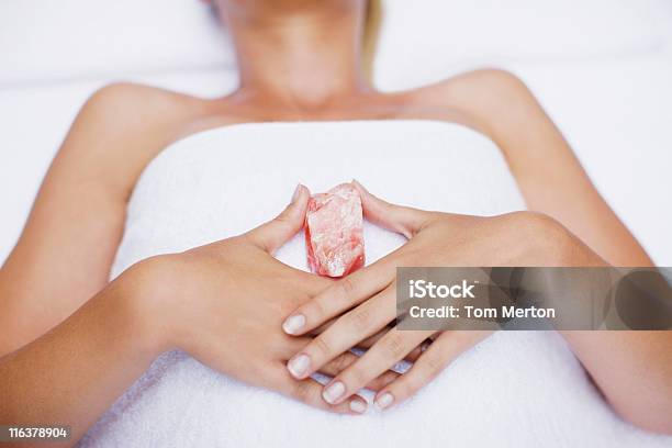 Woman Laying With Crystal Stock Photo - Download Image Now - Crystal, Crystal Healing, Massaging