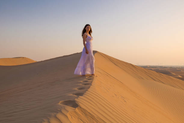 istock UAE. Woman in desert 1163790149