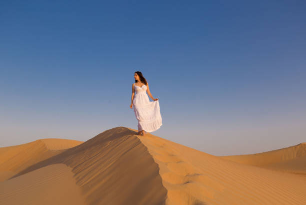 istock UAE. Woman in desert 1163790157