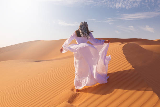 istock UAE. Woman in desert 1163794105