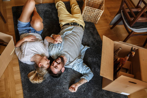 istock Couple moving into new home. 1163794749