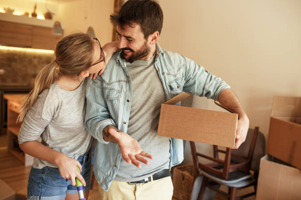 Couple moving into new house.