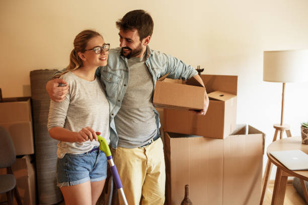 istock Couple moving into new house. 1163794833