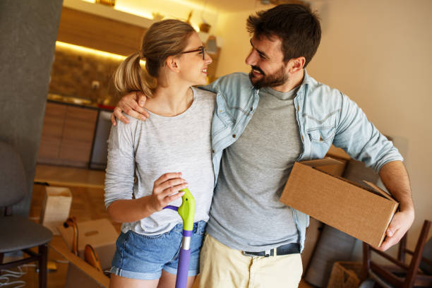 istock Couple moving into new house. 1163794837