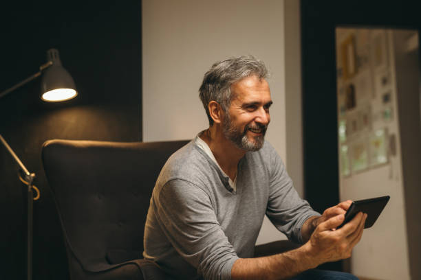 istock senior man at home 1163796497