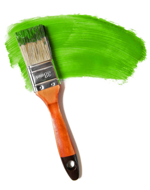 istock Paintbrush with green paint (isolated on white) 1163798754
