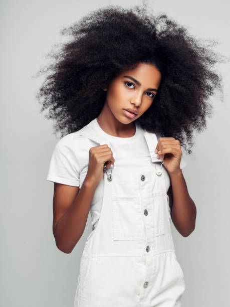 istock Beautiful smiling girl with curly hairstyle 1163799392