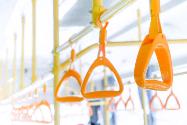 istock Yellow bus handle on ceiling for standing passenger, public transportation train handrail interior 1163804597