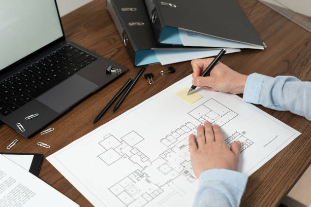 istock Woman working behind wooden table in office 1163804638