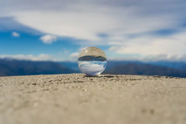 lensball on top of Roys peak, crystal glas ball on top of Roys peak, glas ball on top of a mountain in New Zealand, great Roys peak in wanaka New Zealand