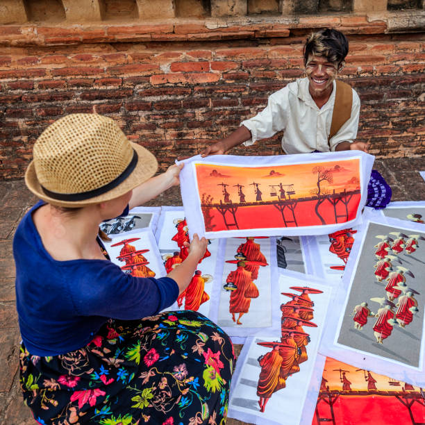 istock Young Burmese boy selling sand paintings in Bagan, Myanmar 1163806947