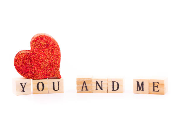 istock you and me written on wooden cubes 1163809406