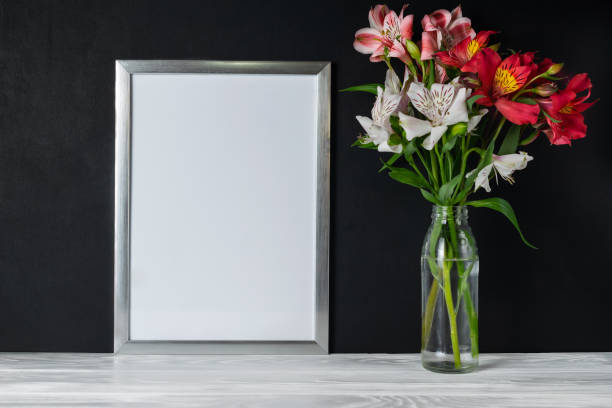 istock Mock up white frame with alstroemeria flowers copy space for text 1163809615