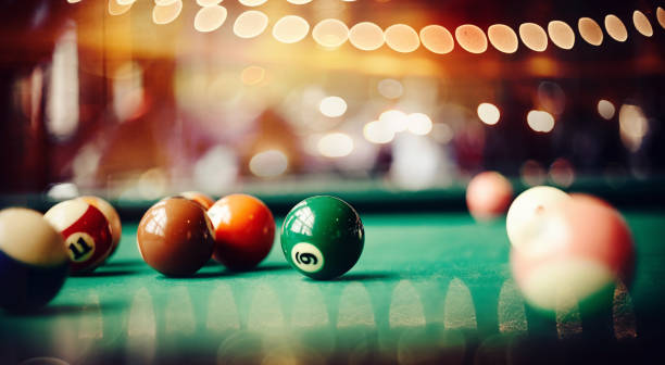 istock Colorful billiard balls on a green billiard table. 1163810028