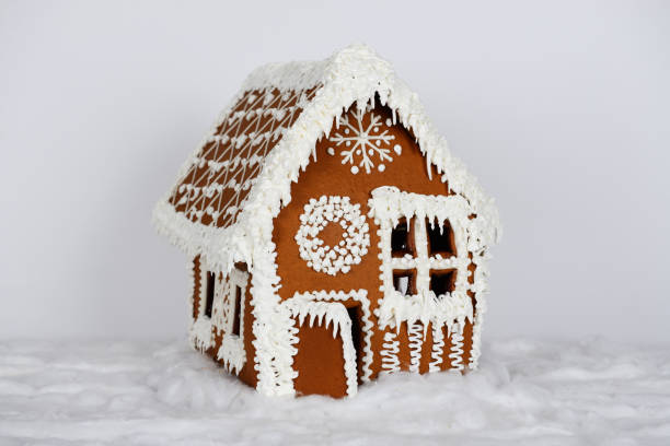 istock The hand-made eatable gingerbread house and snow decoration 1163811544