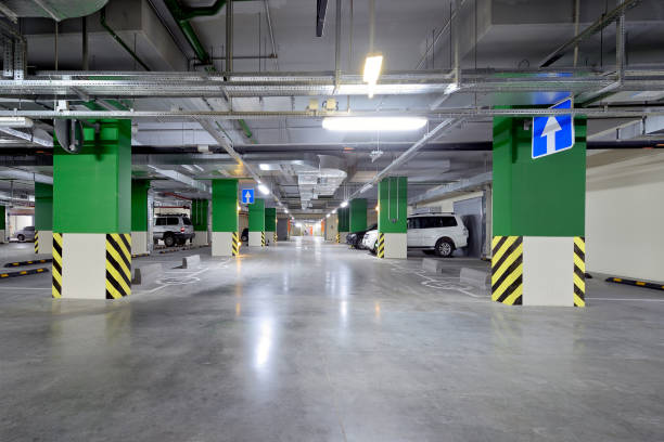 istock Modern underground parking garage with cars 1163811816