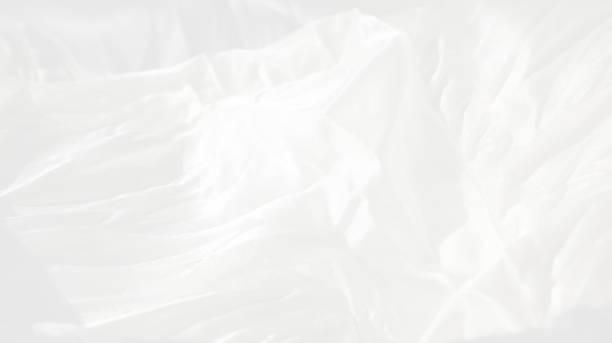 istock Very gentle delicate beautiful elegant light white blur background - natural matte and shiny silk in drapery, folds, wrinkles for wedding cards, exquisite solemn backgrounds 1163812181