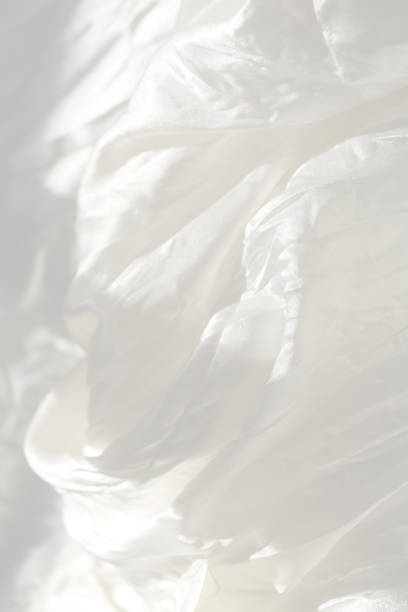 istock Vertical very gentle delicate dream beautiful elegant light white blur background - natural matte and shiny silk in drapery, folds, wrinkles for wedding cards, exquisite solemn backgrounds 1163812968
