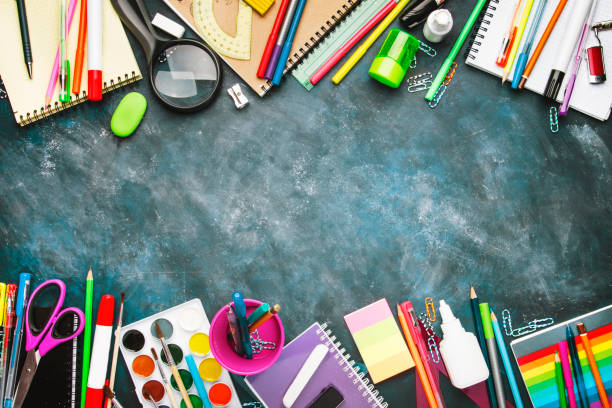 istock Back to school background with space for text, notebooks, pens, pencils, other stationery on blue chalk board desk, education concept, flat lay, top view 1163812989