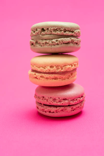 istock Colorful macaroons over a pink bakcground 1163816105