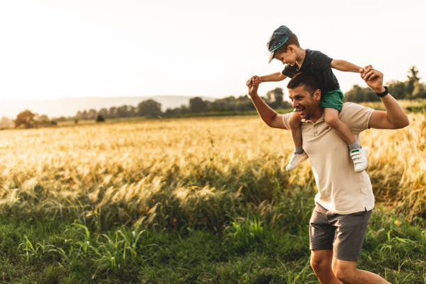 istock Happy family, father playing with son 1163819610