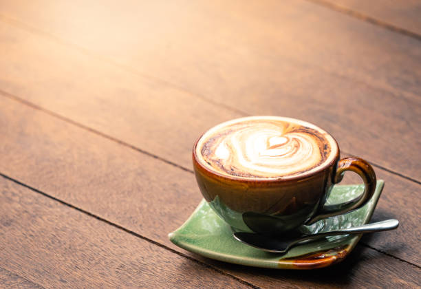 istock cappuccino coffee with old wooden table 1163820407