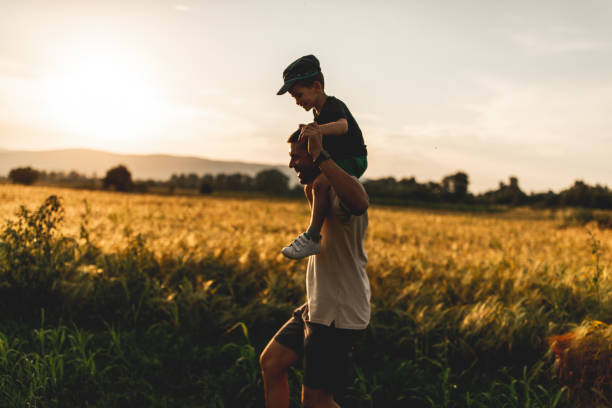 istock Happy family, father playing with son 1163821321