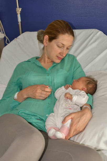 istock A mother looks at her newborn baby 1163822764
