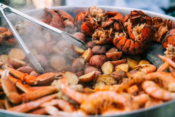 Large sheet of grilled seafood Large sheet of grilled seafood at a county fair festival. This includes lobsters, shrimp and crab lobster seafood photos stock pictures, royalty-free photos & images