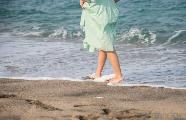 istock Girl  with bare feet 1163823686