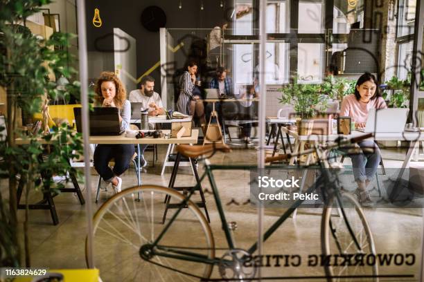 Arriving To Work By Bike Stock Photo - Download Image Now - Coworking, Office, Environmental Conservation
