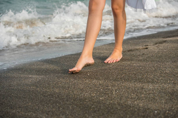 istock Girl  with bare feet 1163825620