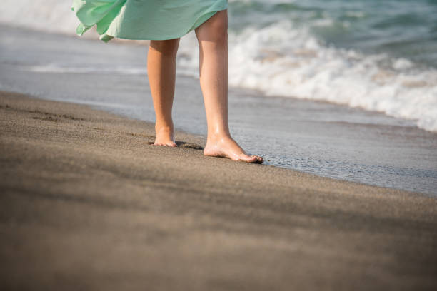 istock Girl  with bare feet 1163825675
