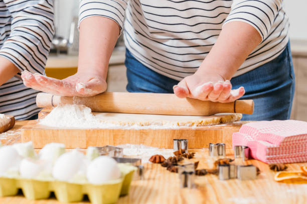istock homemade pastry woman rolling dough flour 1163827733