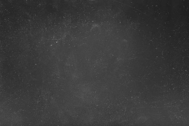 istock dust scratches black background white lights 1163827793