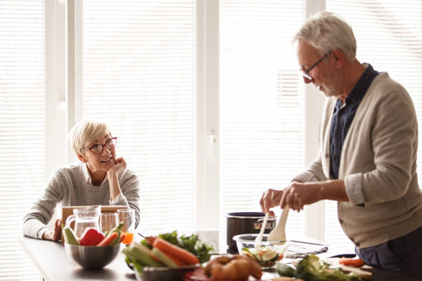 istock Cheerful senior married couple in the kitchen 1163827874