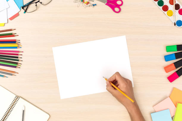 istock Workspace. Desk top view persong drawing picture close-up 1163828030