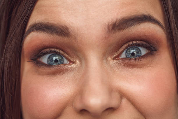 istock Freestyle. Woman standing isolated looking camera excited close-up 1163828035