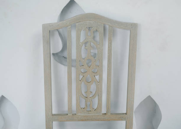 istock vintage old chair near white wall 1163828400