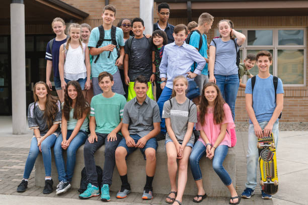 istock Portrait of elementary-age students outside the school 1163833354