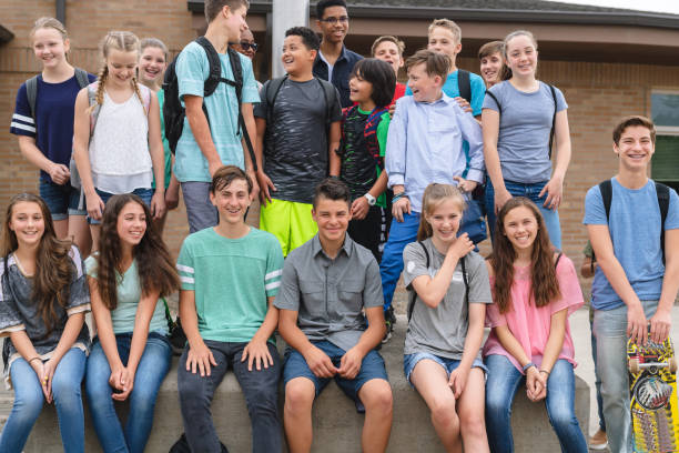 istock Portrait of elementary-age students outside the school 1163833366