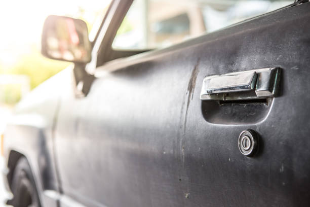 istock Selective focus of Old car door handle with sunlight 1163835880