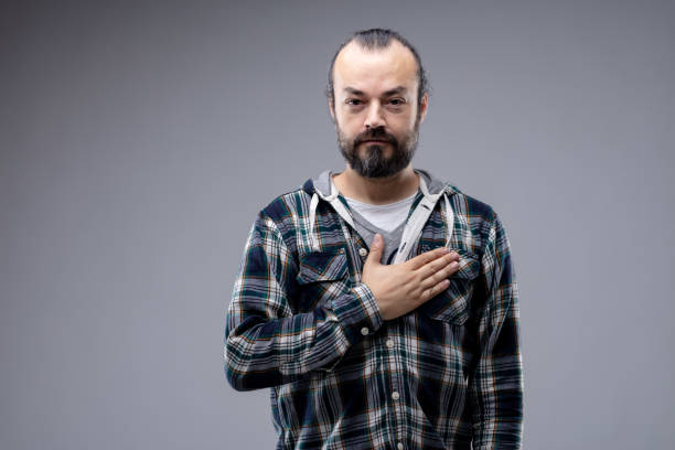 istock Patriotic or sincere man placing hand on heart 1163836937