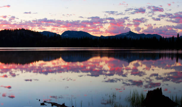 An early morning (before sunrise) image of Granite Lake near McCall, Idaho, and the mountains to the East.   The rough peak on the right is Rain Peak.